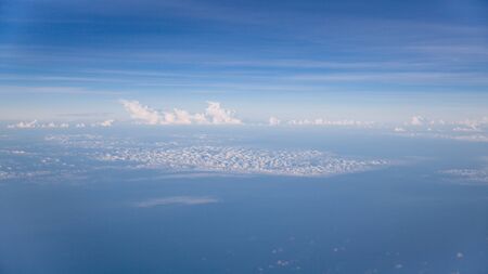 View of the clouds from an airplane. Aerial view of Blue sky and Cloud Top view from airplane...