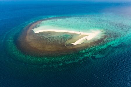 White sandy island with coral reefs.White sandbar.Atoll near the island of Camiguin, Philippines,...