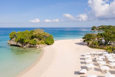 Blue sea and white sandy beach in sunny weather. Beautiful sea coast on the island of Barokai,...
