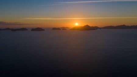 Sunset over the sea with the islands. Seascape with sunset aerial view