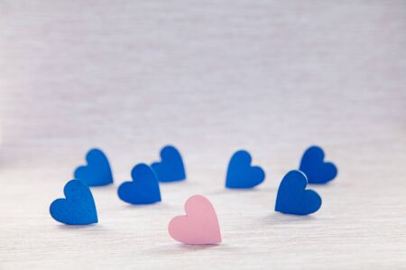 Wooden hearts on beautiful background. background for greetings on Valentine's Day. Blue hearts.