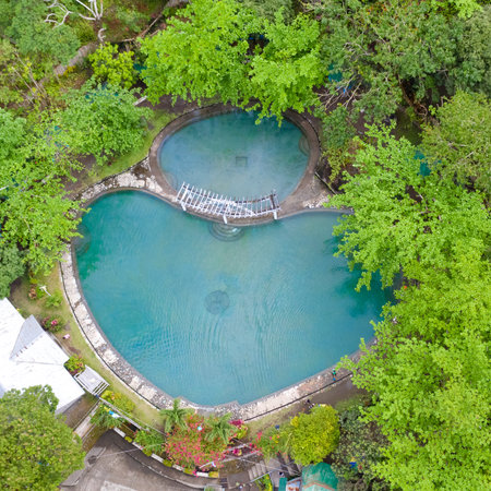 Soda Swimming Pool. Swimming pool in tropical forest on Camigin Island, Philippines. Park with swimming pool and soda water for tourists, view from above.の写真素材