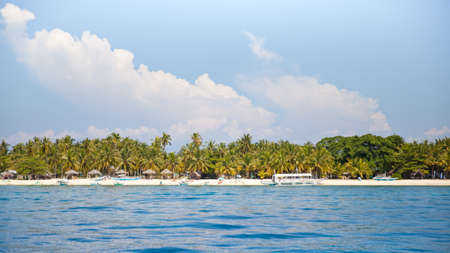 Tropical island view from the sea. Turquoise sea water.の写真素材