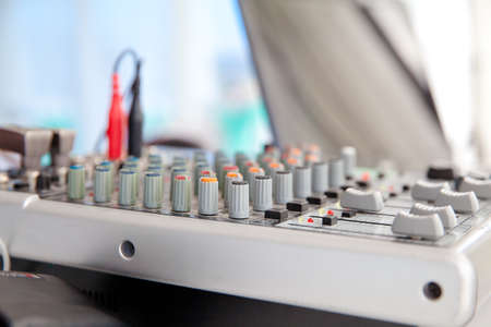 DJ remote control. Audio remote mixer with amplifier and wires. mixer in studioの写真素材