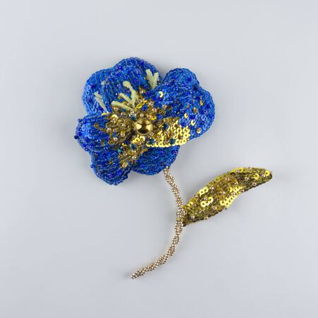 Brooch made of beads, sequins and threads. Blue flower. Handmade jewelry. Crafts and creativity.の写真素材