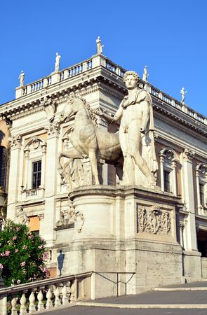 ROME, ITALY? JULY 19, 2014: Massive ancient statues of Castor with horse at the monumental entrance to the Capitoline Hill in Rome on JULY 19, 2014のeditorial素材