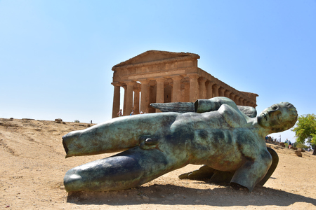 Fallen Icarus bronze statue in front of the Temple of Concordia - Agrigento - Sicily - Italyのeditorial素材