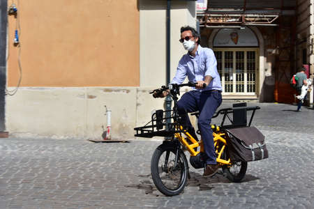 ROME, ITALY - MAY 12: Unknown man on motorbike in medical mask passes in front of Pantheon in Piazza della Rotonda during Italian lockdown period on May 12, 2020 Rome, RM, Italyのeditorial素材