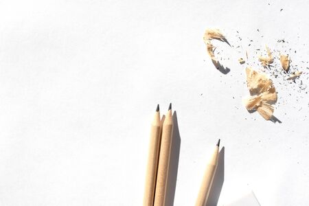 Pencil case and pencils are lying on the table in bright daylight. Natural unpainted wood. Eco-friendly materials.の写真素材