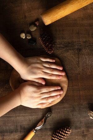 Modeling with salt dough on the kitchen table. Natural materials for the game, the natural composition of the product. Creative development of children in the period of self-isolation.の写真素材