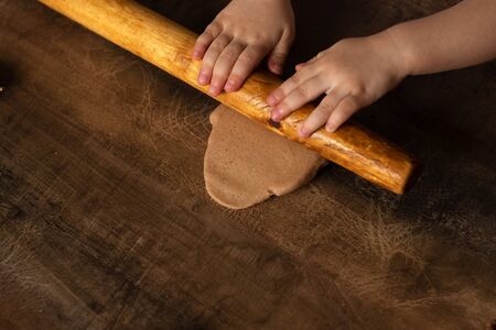 Modeling with salt dough on the kitchen table. Natural materials for the game, the natural composition of the product. Creative development of children in the period of self-isolation.の写真素材