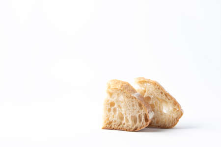 Two pieces of white wheat bread with intoxicated sourdough. White backgroundの写真素材