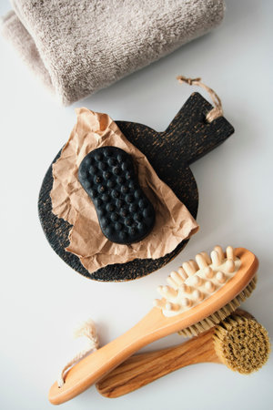 Coffee soap in craft paper lies on a white tableの写真素材