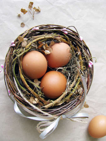 Eggs in a decorated nestの写真素材