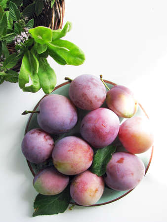 Plums on a plateの写真素材