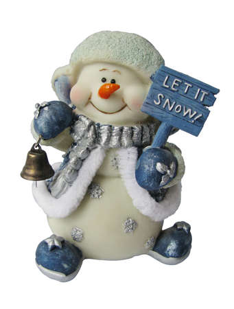 Little cute snowman toy in a hat and jacket with a bell in his hand. Isolatedの写真素材