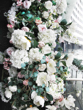 Flower garlands at the flower shop door in the winter cityの写真素材
