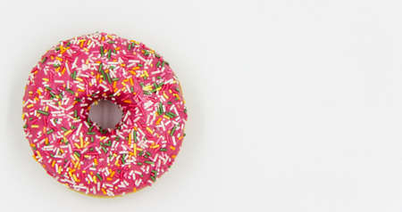 Pink tasty donut isolated on white background