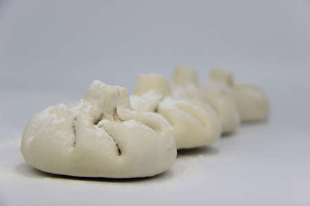 three khinkali on a white background, georgian foodの写真素材