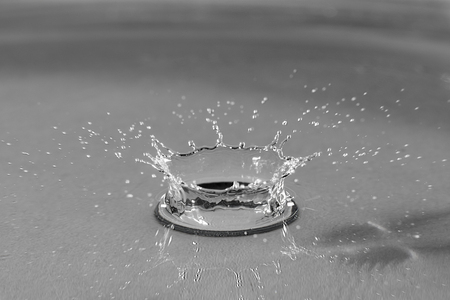 Water splash of red color close-up cの写真素材