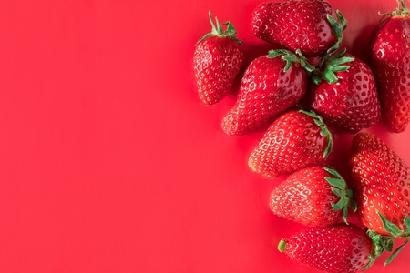Strawberry on red background tasty postcard paperの写真素材
