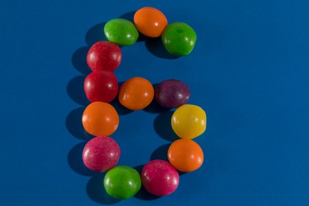 Image of colorful and tasty candies skittles figue six postcardの写真素材