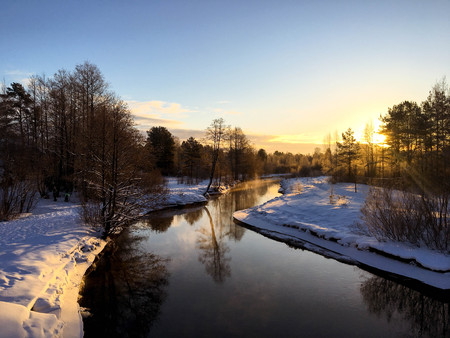 Fosty winter morning landscape with forest river, Russiaの写真素材