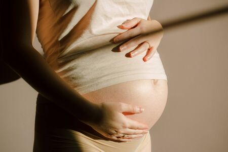 Belly of a pregnant womanの写真素材