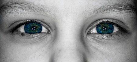 mystical eyes of a child black and white photo, blue colorの写真素材