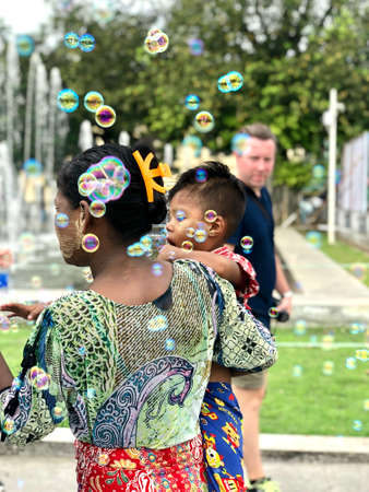 Mother and child playing with soap bubblesのeditorial素材