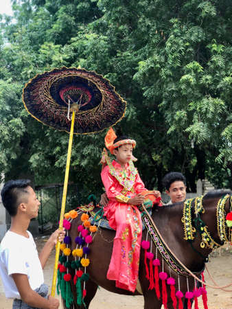 Bagan, Myanmar - 2019: Boy in the traditional Shinbyu, buddhist novitiation ceremonyのeditorial素材
