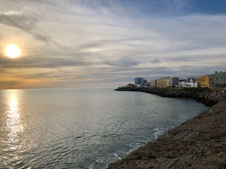 Cadiz, Andalucia, Spain - December, 2019: Seaside boardwalk in the old town part of Cadiz during sunsetのeditorial素材