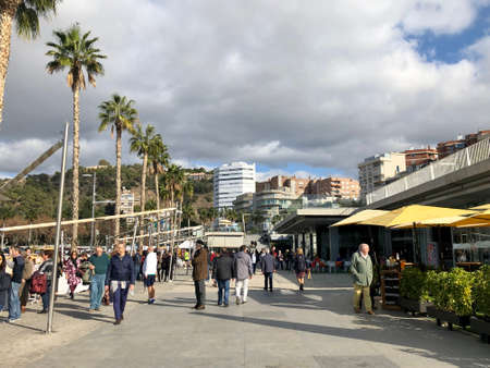 Malaga, Spain - December 29, 2019: People enjoying the holidays in Muelle Uno, the waterfront promenade in Malagaのeditorial素材