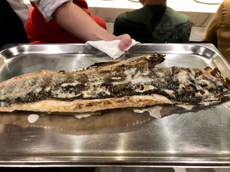 Fine dining, whole fish served at Michelin restaurant