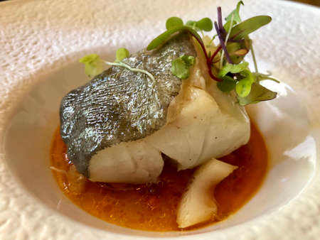 Fine dining, smoked cod served in orange vinaigrette