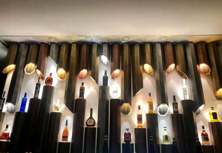 Bottles in display in cool design and with light