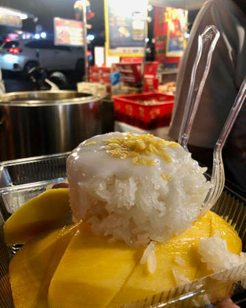 Bangkok, Thailand - November 10, 2019: Mango with sticky rice in Yaowarat Chinatown Street Food Marketのeditorial素材