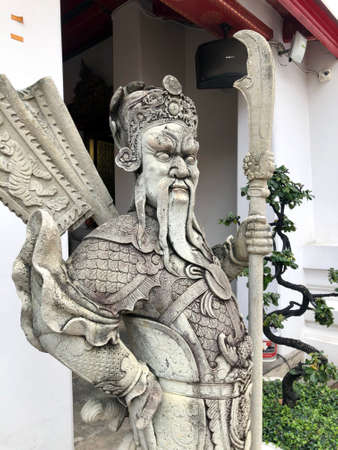 Bangkok, Thailand - November 1, 2019: Guardian statue in Wat Pho temple