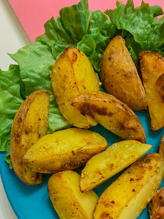 fried homemade potatoes and herbsの写真素材