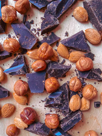 chocolate and nuts on the wooden backgraundの写真素材