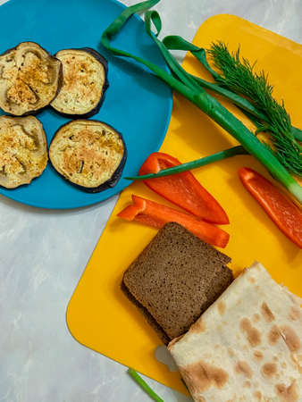eggplant with red pepper and black breadの写真素材
