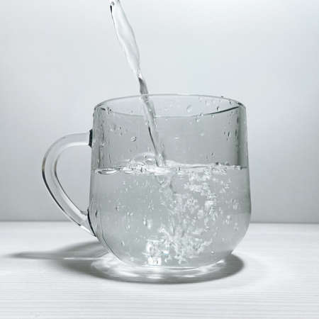 refreshing water in a glass mug