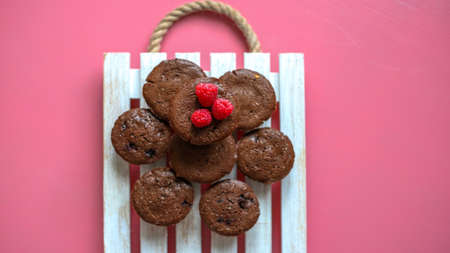 chocolate muffins on a white trayの写真素材