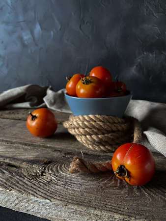 fresh tomatoes on a dark backgroundの写真素材