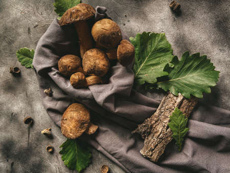mushrooms in a basket on a dark backgroundの写真素材