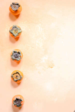 bright and fresh persimmon on a light backgroundの写真素材