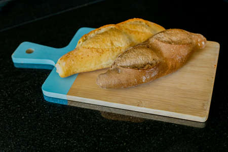 turkish homemade bread on a wooden cutting boardの写真素材