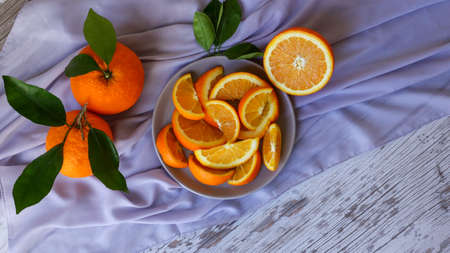 bright and juicy sliced oranges on the tableの写真素材