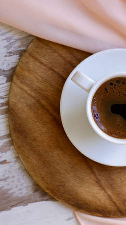 mug of aromatic coffee on a wooden backgroundの写真素材