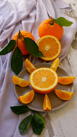 bright and juicy sliced oranges on the tableの写真素材